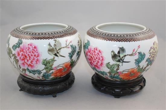 A pair of Chinese famille rose globular bowls, Qianlong marks, Republic period, 16.5cm diam, stands